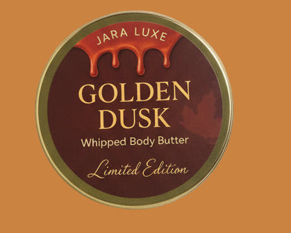 Jara Luxe Golden Dusk whipped body butter container on a marble surface